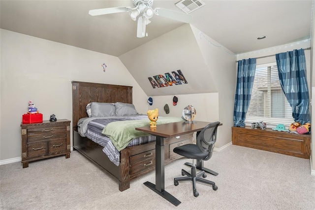 carpeted bedroom with ceiling fan and vaulted ceiling