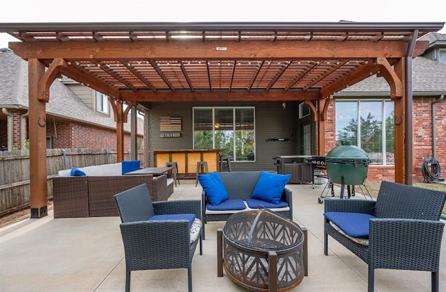 view of patio with a pergola, an outdoor living space with a fire pit, and a bar