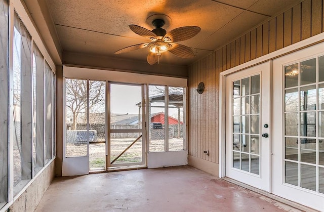 unfurnished sunroom with french doors and ceiling fan