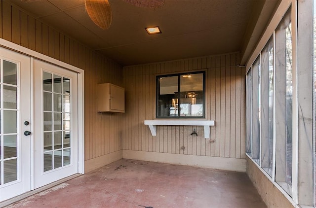 unfurnished sunroom with french doors