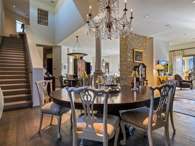 dining room featuring decorative columns and dark hardwood / wood-style floors