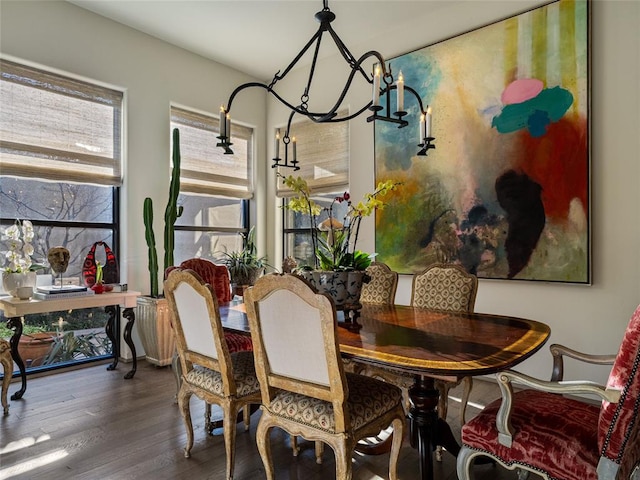 dining room with a notable chandelier and wood-type flooring