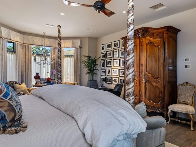 bedroom with ceiling fan and hardwood / wood-style floors