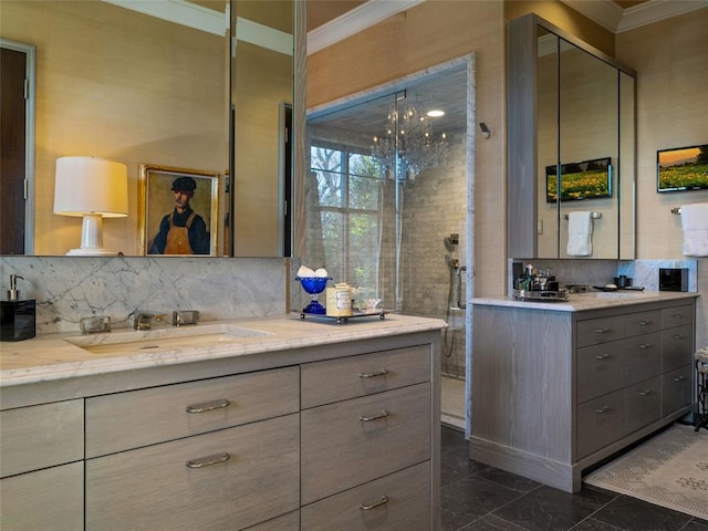 bathroom with ornamental molding, decorative backsplash, and vanity