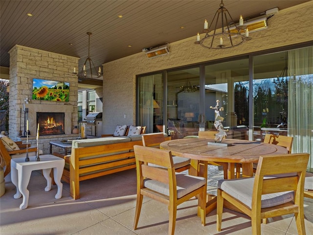 view of patio featuring an outdoor living space with a fireplace