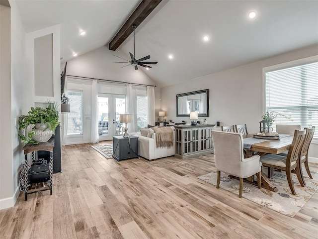 interior space with french doors, a healthy amount of sunlight, beam ceiling, and light wood-type flooring