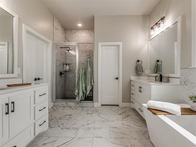 bathroom with walk in shower and vanity