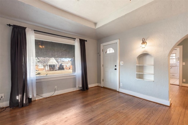 entrance foyer featuring hardwood / wood-style flooring and a wealth of natural light