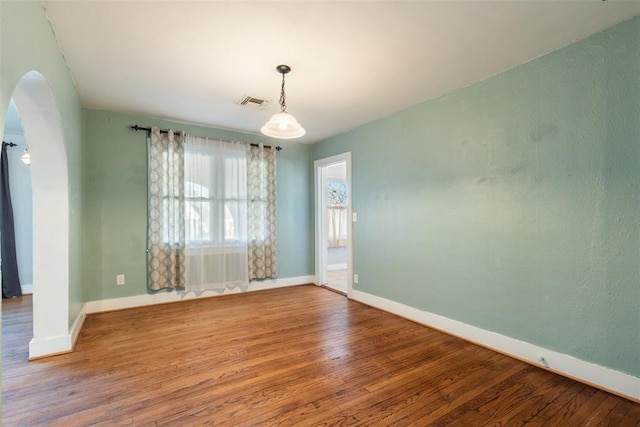 unfurnished room with hardwood / wood-style floors