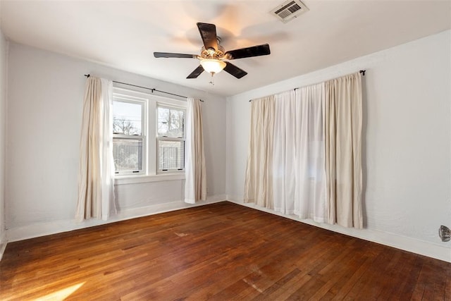 empty room featuring hardwood / wood-style flooring and ceiling fan