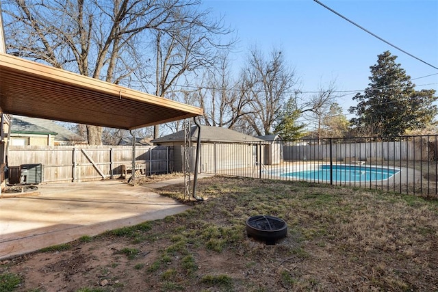 view of yard with a fenced in pool, central AC unit, and a patio area