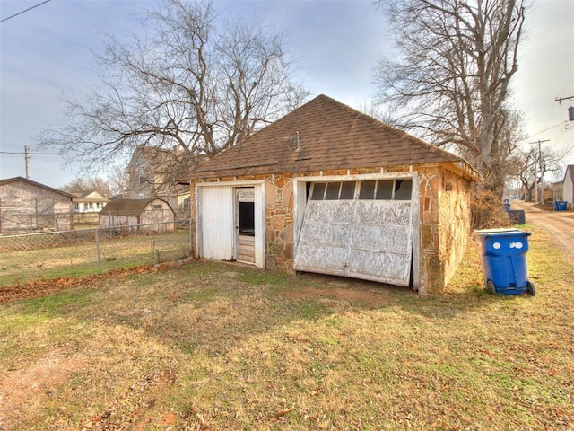 garage with a yard