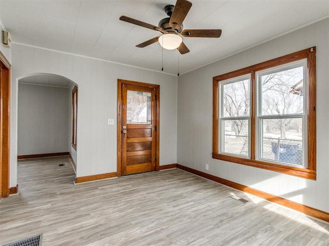 spare room featuring ceiling fan and light hardwood / wood-style flooring