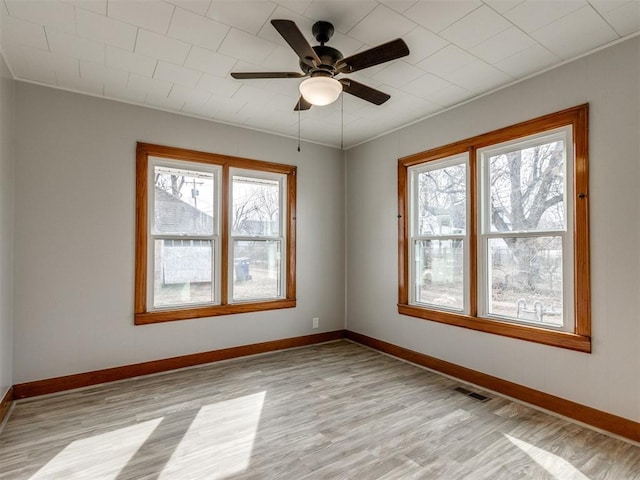 unfurnished room featuring ceiling fan and light hardwood / wood-style floors