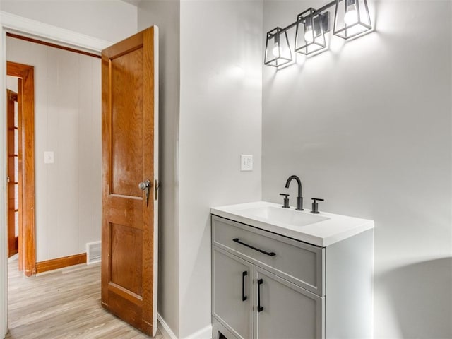 bathroom with vanity and hardwood / wood-style floors