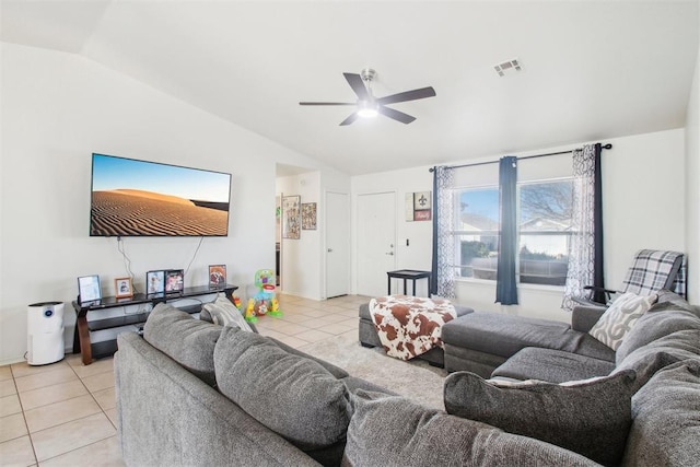 living room with ceiling fan, lofted ceiling, and light tile patterned floors