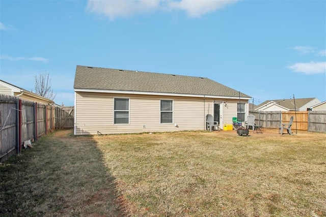 back of house with a yard