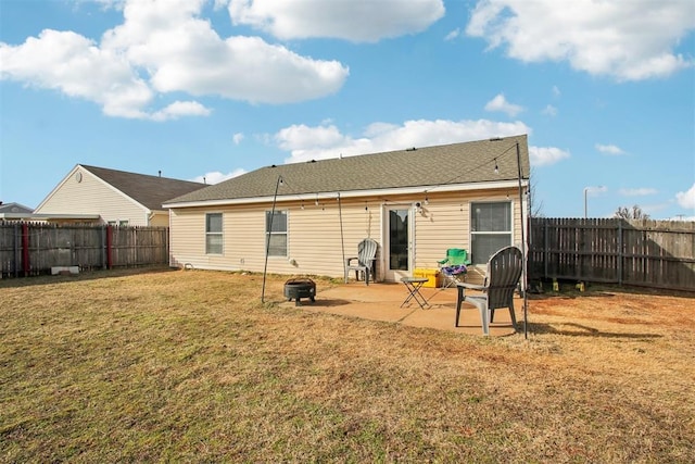 back of house with a patio, a yard, and an outdoor fire pit