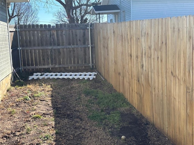 view of yard with a fenced backyard