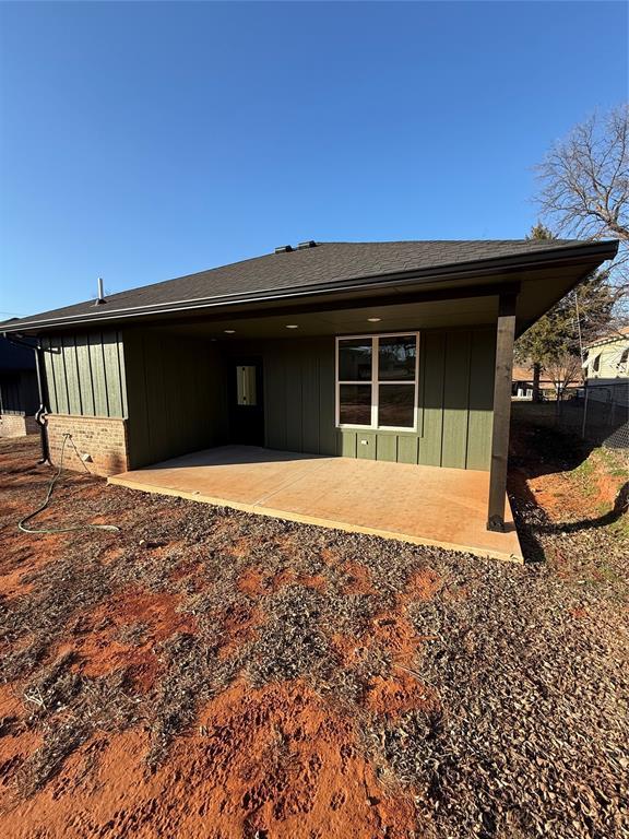 back of property with a patio area