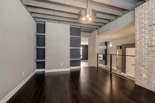 1548 NW 175th Ct, Edmond, OK 73012 - unfurnished living room with hardwood / wood-style floors, beamed ceiling, and baseboards