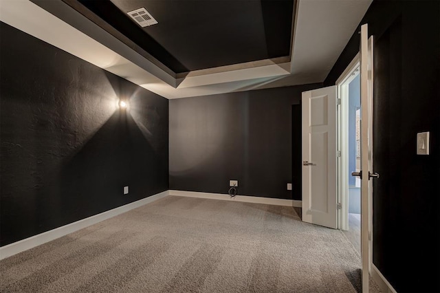 1548 NW 175th Ct, Edmond, OK 73012 - unfurnished room with a raised ceiling, carpet floors, and baseboards