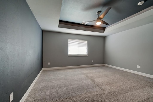 1548 NW 175th Ct, Edmond, OK 73012 - empty room with a raised ceiling, a ceiling fan, carpet floors, and baseboards