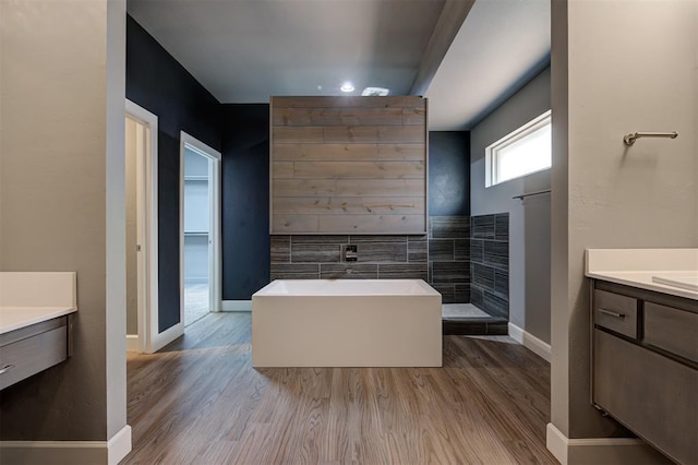 1548 NW 175th Ct, Edmond, OK 73012 - full bath featuring vanity, wood finished floors, a tub to relax in, and baseboards