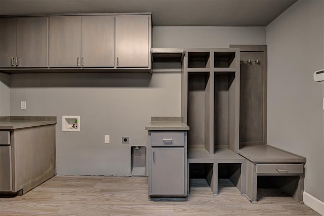 1548 NW 175th Ct, Edmond, OK 73012 - washroom with hookup for an electric dryer, cabinet space, washer hookup, and light wood finished floors