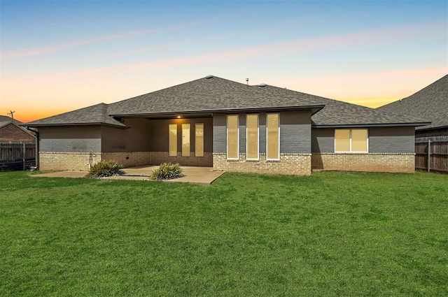 1548 NW 175th Ct, Edmond, OK 73012 - back of property with brick siding, roof with shingles, and a patio