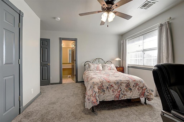 bedroom featuring visible vents, ensuite bathroom, carpet, baseboards, and ceiling fan