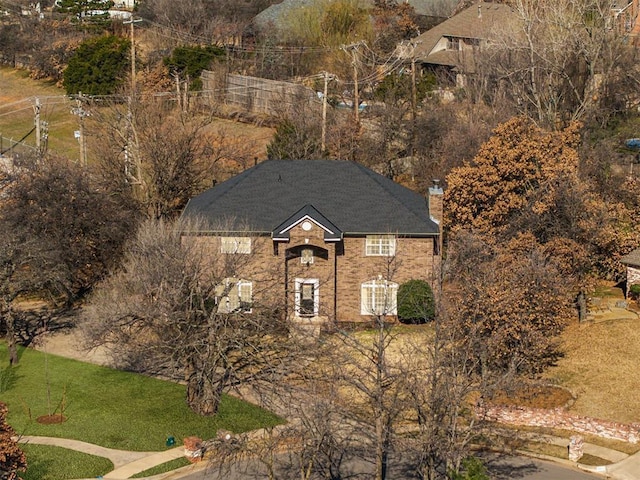 view of front facade featuring a chimney