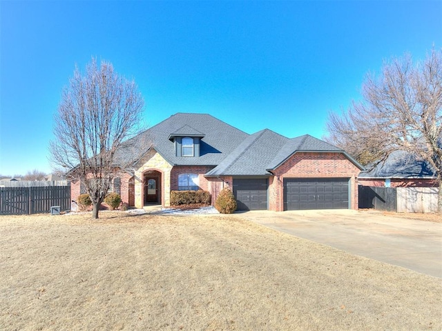 view of front facade featuring a garage and a front lawn