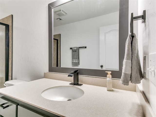 bathroom with visible vents and vanity