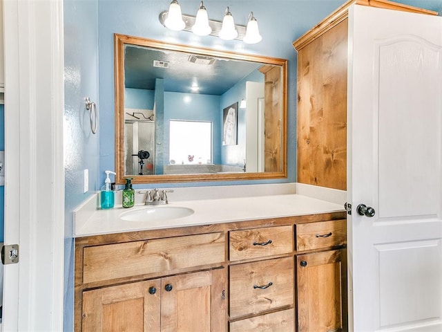 bathroom with visible vents and vanity