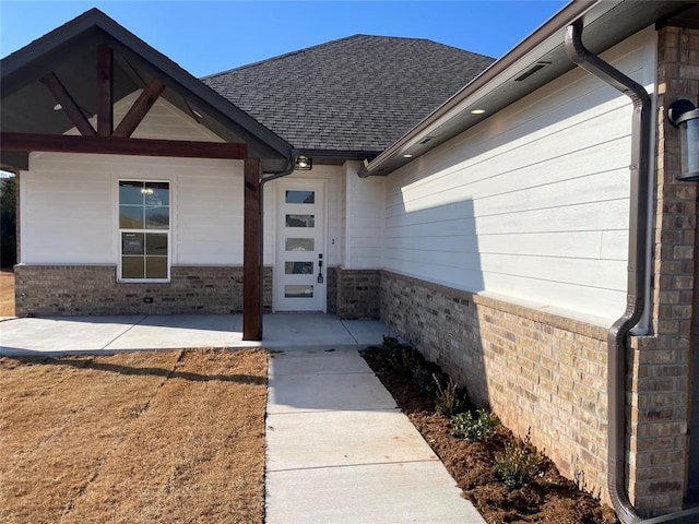 property entrance with a patio