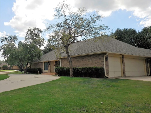 single story home with a garage and a front yard