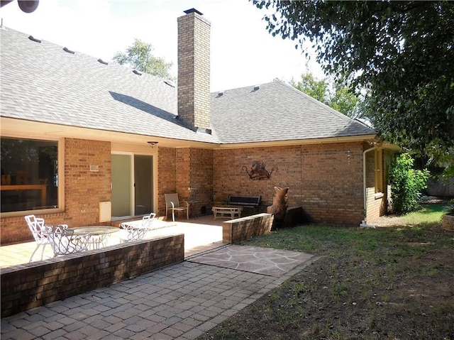 rear view of house featuring a patio