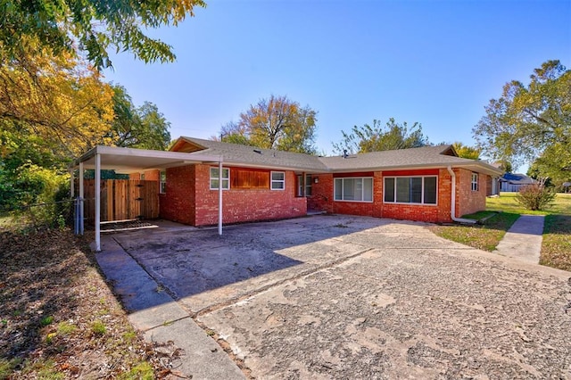 view of front of property featuring a carport