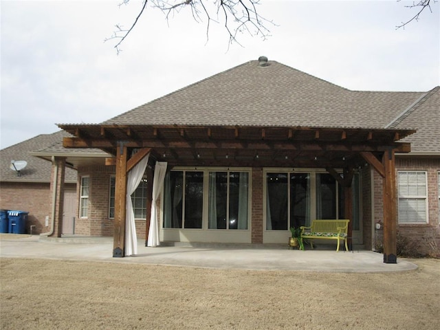 back of property with a patio