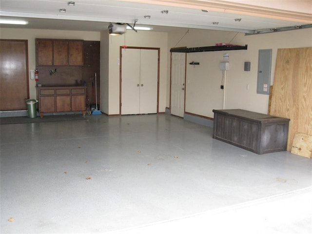 garage featuring a garage door opener and electric panel