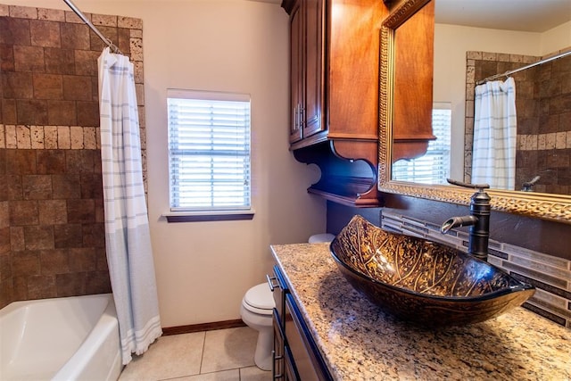 full bathroom featuring vanity, shower / bath combo, tile patterned floors, and toilet