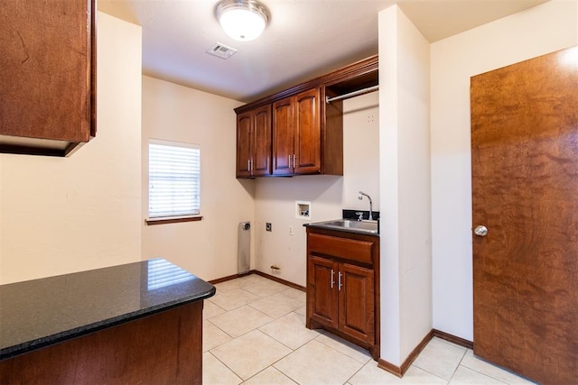 kitchen with sink and light tile patterned floors