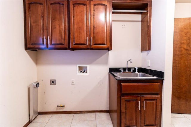 laundry room featuring sink, electric dryer hookup, hookup for a washing machine, cabinets, and light tile patterned flooring