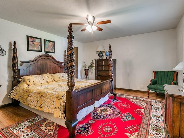 bedroom featuring hardwood / wood-style floors and ceiling fan