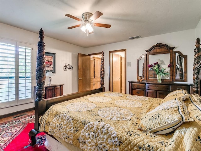 bedroom featuring hardwood / wood-style floors and ceiling fan