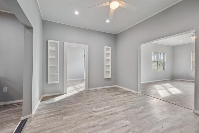 empty room with light hardwood / wood-style flooring and ceiling fan