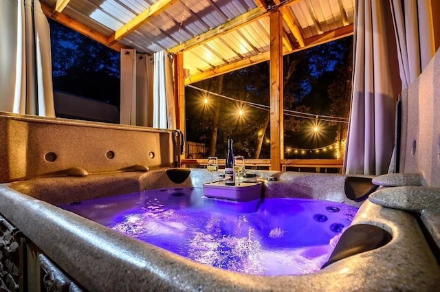 view of patio / terrace with a hot tub