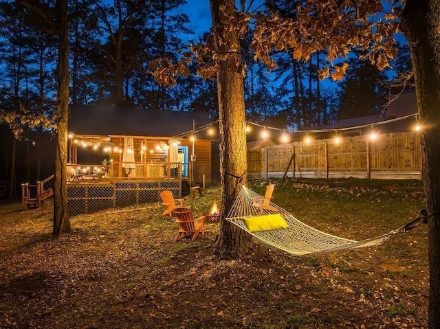 yard at twilight with a deck