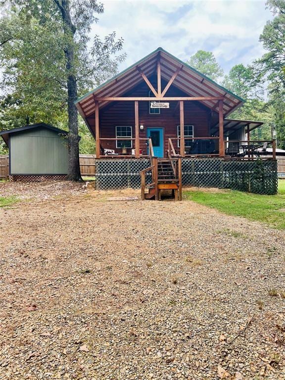 view of front of house with a storage shed